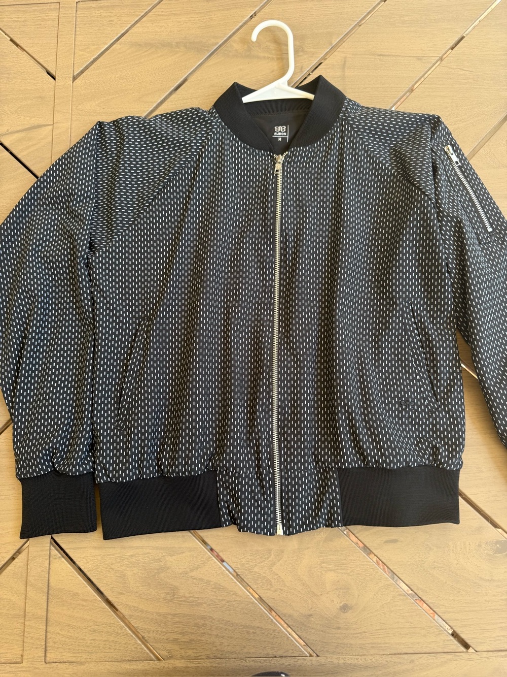 Albión Fit Women’s Bomber Jacket Color Black with White Accents. Size Medium